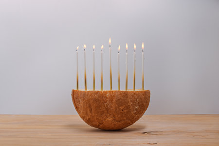 Creative Hanukkah menorah on a wooden table.の写真素材