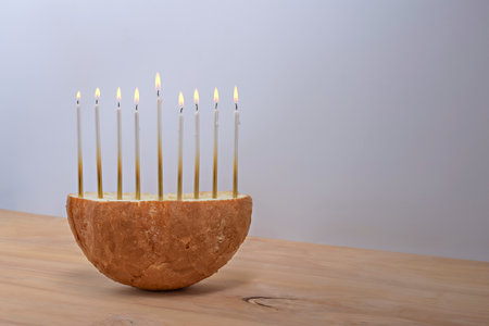 Creative Hanukkah menorah on a wooden table.の写真素材