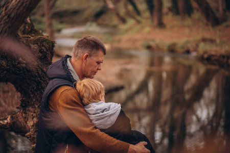 Father and little son tourists autumn time leisure, vacation hiking or traveling touristic activity.の写真素材