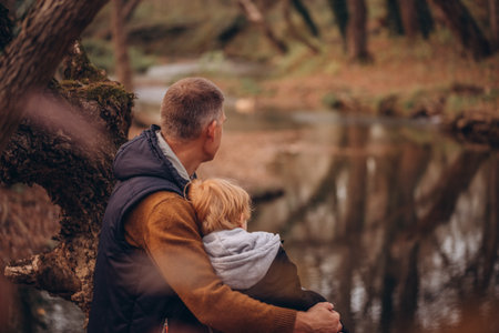 Father and little son tourists autumn time leisure, vacation hiking or traveling touristic activity.の写真素材