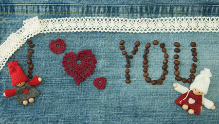 Valentine, greeting card with coffee beans and knitted red hearts, loving couple man and woman.の写真素材
