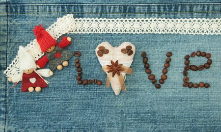 Valentine, greeting card with textile coffee heart, coffee beans and knitted loving couple man and woman.の写真素材