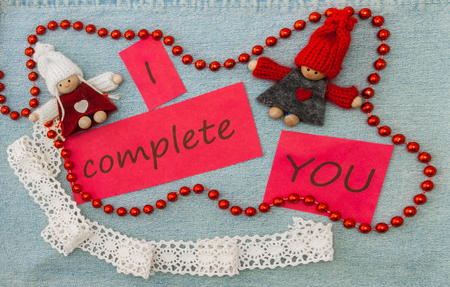Valentine, greeting card with knitting couple in love and red beads.の写真素材