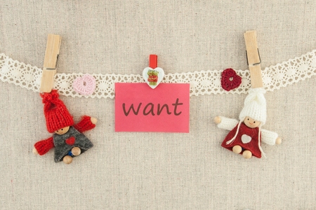 Valentine, greeting card. Wooden pins  knitted loving couple man and womanの写真素材