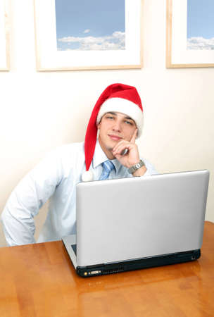 Happy man with santa hatの写真素材