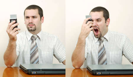 Tired and angry businessman receiving bad news on the phoneの写真素材