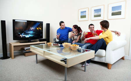 Friends enjoying a celebratory drink of champagneの写真素材