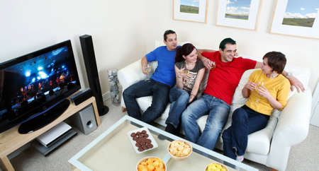 Friends enjoying a celebratory drink of wineの写真素材