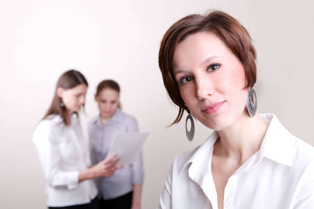 Successful Business Team in a office environment looking satisfied.の写真素材