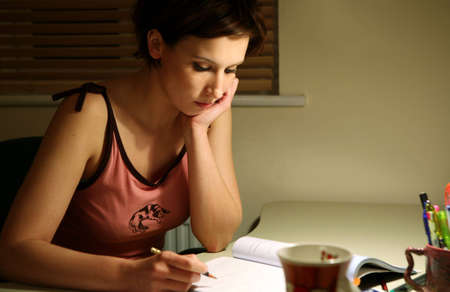 Young student at a desk preparing for an examの写真素材