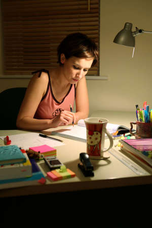 Young student at a desk preparing for an examの写真素材