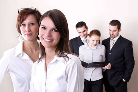 Successful Business Team in a office environment looking satisfied.の写真素材