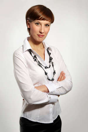 Sexy young business woman, arms crossed, portrait の写真素材