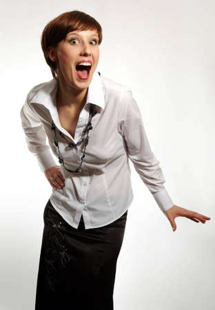 smiling friendly attractive young businesswoman on white backgrounの写真素材