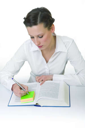 Happy young woman reading books - isolatedの写真素材