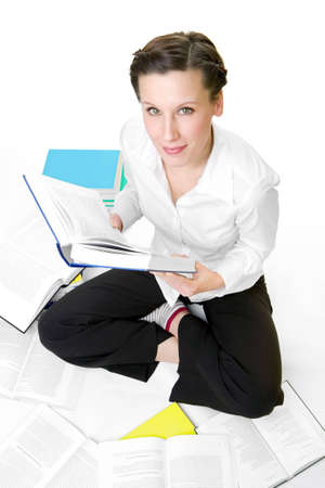 Casual student with books spread aroundの写真素材