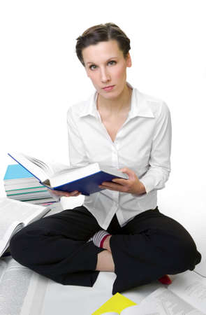 Casual student with books spread aroundの写真素材