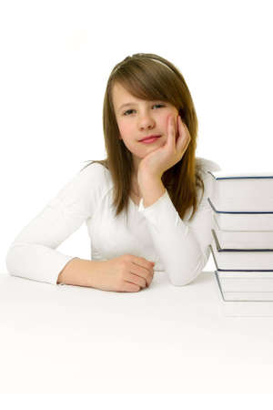 Portrait of Happy young schoolgirl reading bookの写真素材