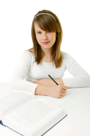 Portrait of Happy young schoolgirl reading bookの写真素材