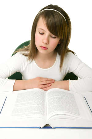 Portrait of Happy young schoolgirl reading bookの写真素材