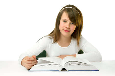 Portrait of Happy young schoolgirl reading bookの写真素材