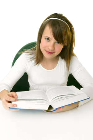Portrait of Happy young schoolgirl reading bookの写真素材