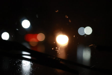 blurry abstract background on a rainy nightの写真素材