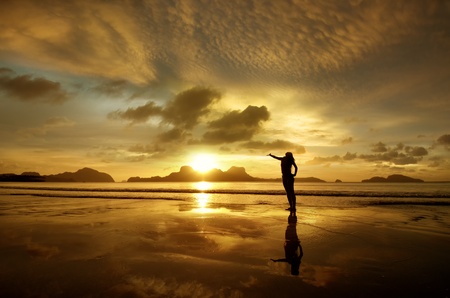 Golden sunset with the girl on the island of El Nido, Philippines の写真素材