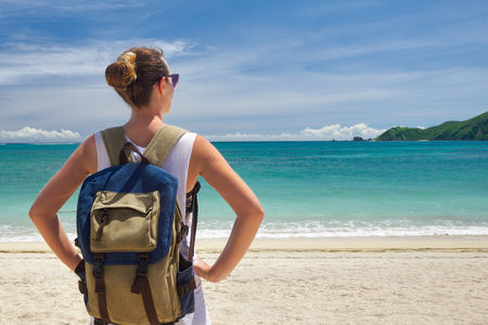 Happy young traveler with a backpack, enjoying the view of a tropical beach on a background the mountains.
Young backpacker traveling along Asia, happy female walking discovering world, summer vacation conceptの写真素材
