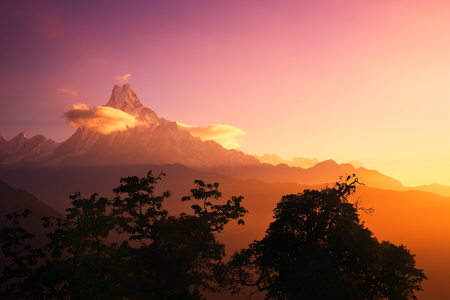 Scenic landscape with a peak Machapuchare, Nepal on sunrise. Natural mountain background.の写真素材