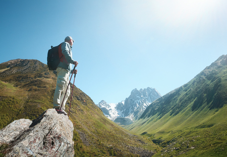 Hiker with Backpack and trekking sticks look view of the Chauhi mountain range in Georgia (country).
Beautiful inspirational landscape, trekking and activity. Travel sport lifestyle concept
の写真素材