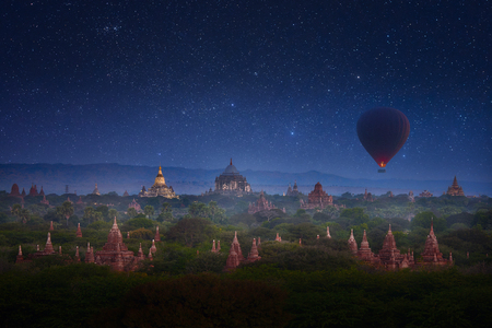 Early morning in Old Bagan with overflying balloon over the ancient temples in the background of the starry sky. Myanmar (Burma)の写真素材