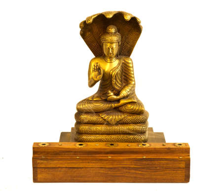 A buddha statue with incense burning in front.の写真素材