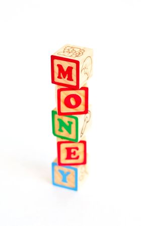 Vintage alphabet blocks spelling out MONEYの写真素材
