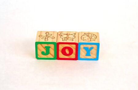 Vintage alphabet blocks spelling out JOYの写真素材