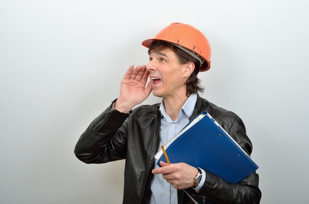 Head of construction workers is calling anyone screamingの写真素材