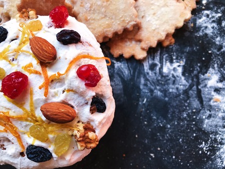 Festive cookies on a black kitchen board with powdered sugar. Restaurant photo with space for your text. View from aboveの写真素材