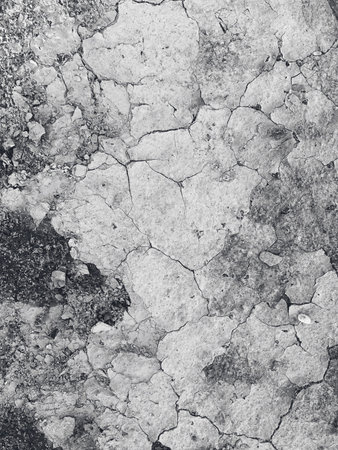 Pebble sand earth background. Dry soil with cracks