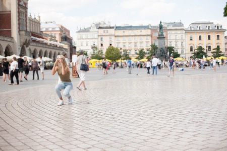 Krakow, Poland. Tourist taking photos in center of cityのeditorial素材
