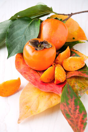 Persimmons fruit with leafの写真素材