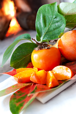 Persimmons fruit with leafの写真素材