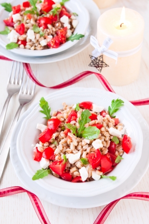 Italian salad with spelt, rucola, cherry tomato and greek cheese fetaの写真素材
