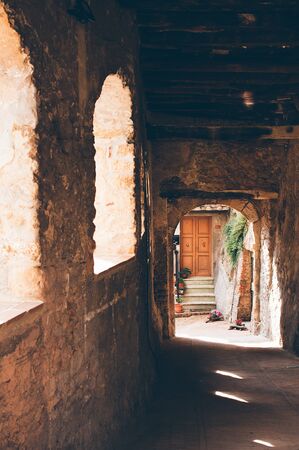 Romantic Italian stone alley, old village, door and arc.の写真素材