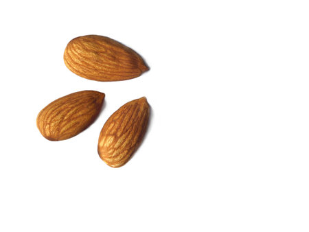 Almond nuts isolated on white backgroundの写真素材