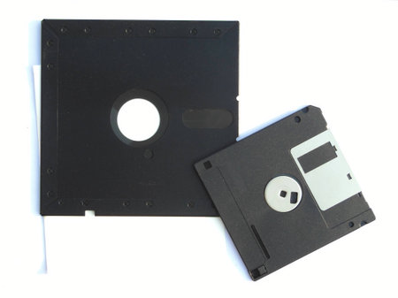 3 5 and 5 25 inch Floppy disk placed side by side flip isolated on white backgroundの写真素材