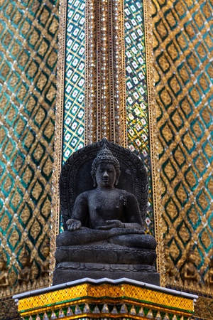 stone buddha on the corner of templeの写真素材