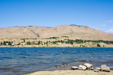 Blue sky with the mountain and lake at Orondo River Park, Washington, USAの写真素材