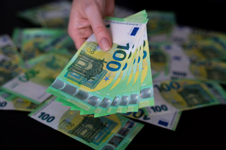 Euro bills in female hands Euro cash background banknotes fan one hundred eurosの写真素材