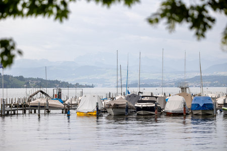motor yachts and boats against the backdrop of mountainsの写真素材