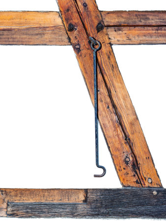 Isolated old wood board. wooden beams. Iron hook hanging on wooden beams. Old wooden beams.の写真素材